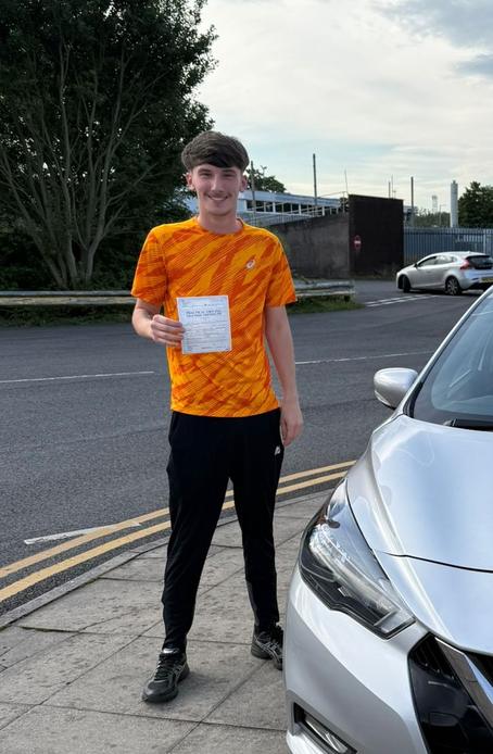 DriveCrest student celebrating after passing their driving test in Greater Manchester