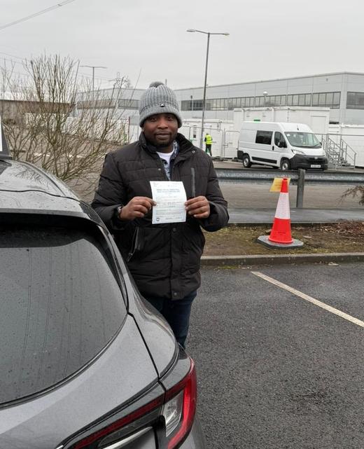 Student of a DriveCrest driving instructor holding their pass certificate