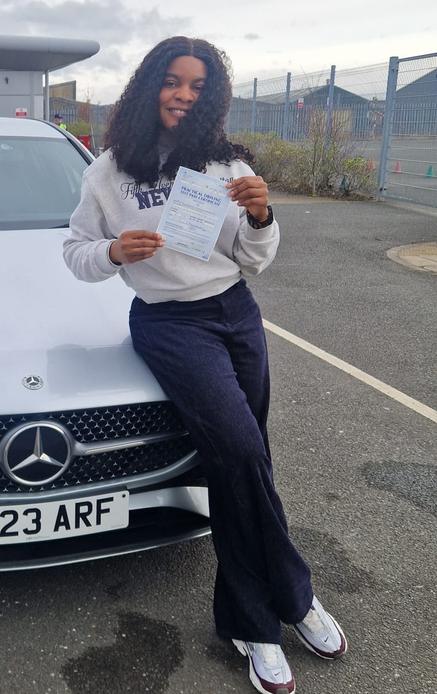 Student celebrating after driving lessons in Greater Manchester