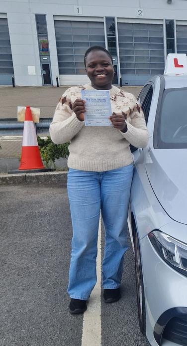 Student celebrating after driving lessons in Greater Manchester