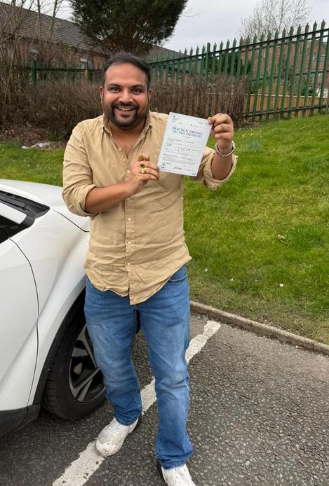 Happy new driver after driving lessons with DriveCrest in Manchester