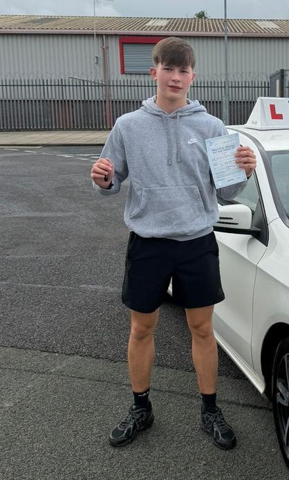 Student celebrating after completing driving lessons with DriveCrest