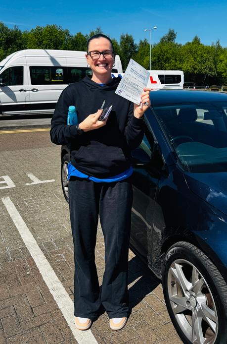 Student celebrating after completing driving lessons with DriveCrest