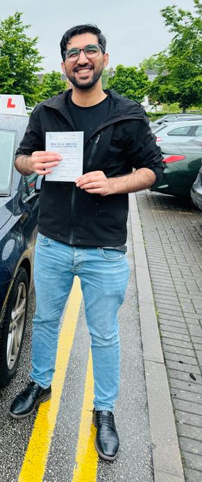 DriveCrest learner celebrating a driving test pass in Greater Manchester