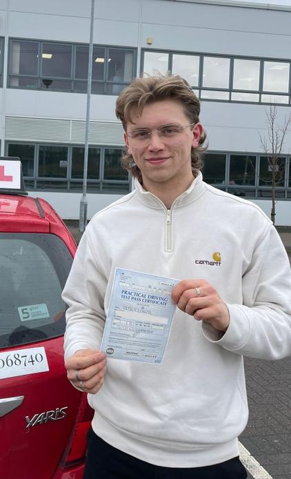 Student celebrating after driving lessons in Greater Manchester