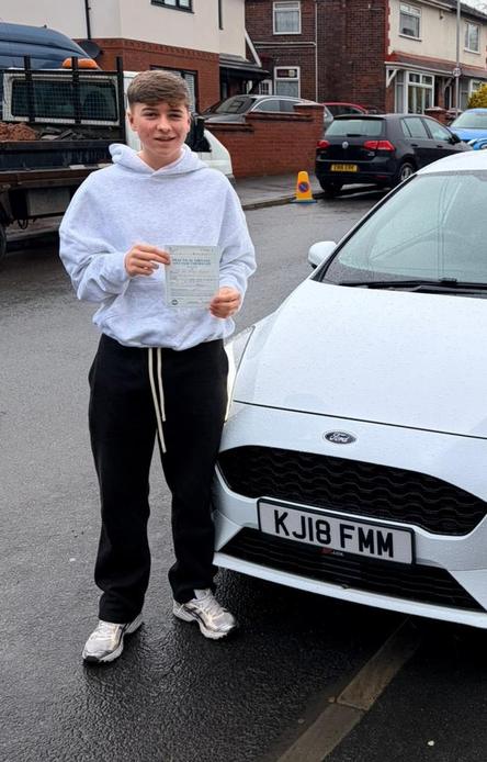 DriveCrest student celebrating after passing their driving test in Greater Manchester