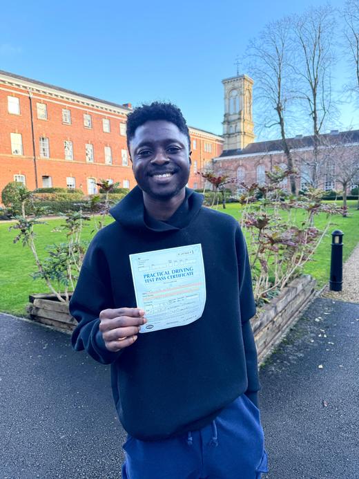 Manchester learner celebrating becoming a qualified driver with DriveCrest