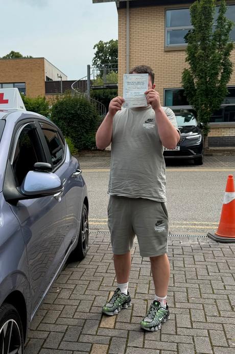Manchester learner celebrating becoming a qualified driver with DriveCrest