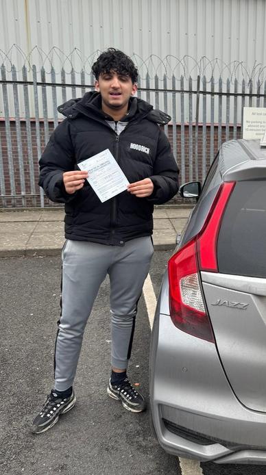 Happy new driver after driving lessons with DriveCrest in Manchester